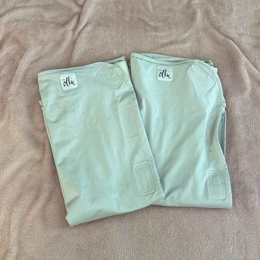 Two gray The Ollie® Swaddles